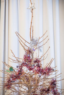 dead christmas tree with tinsel