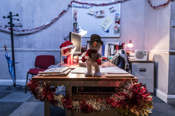 room with desk and christmas tinsel