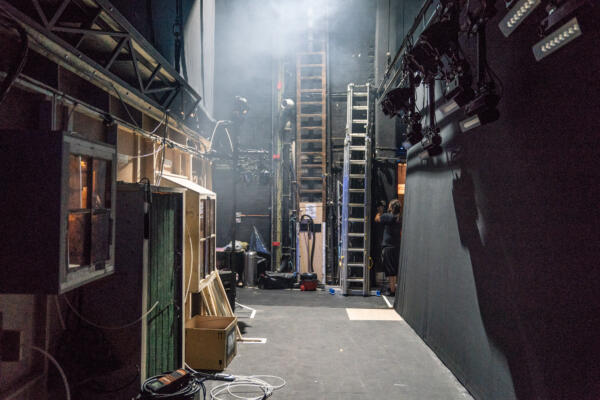backstage view of ladders and equipment