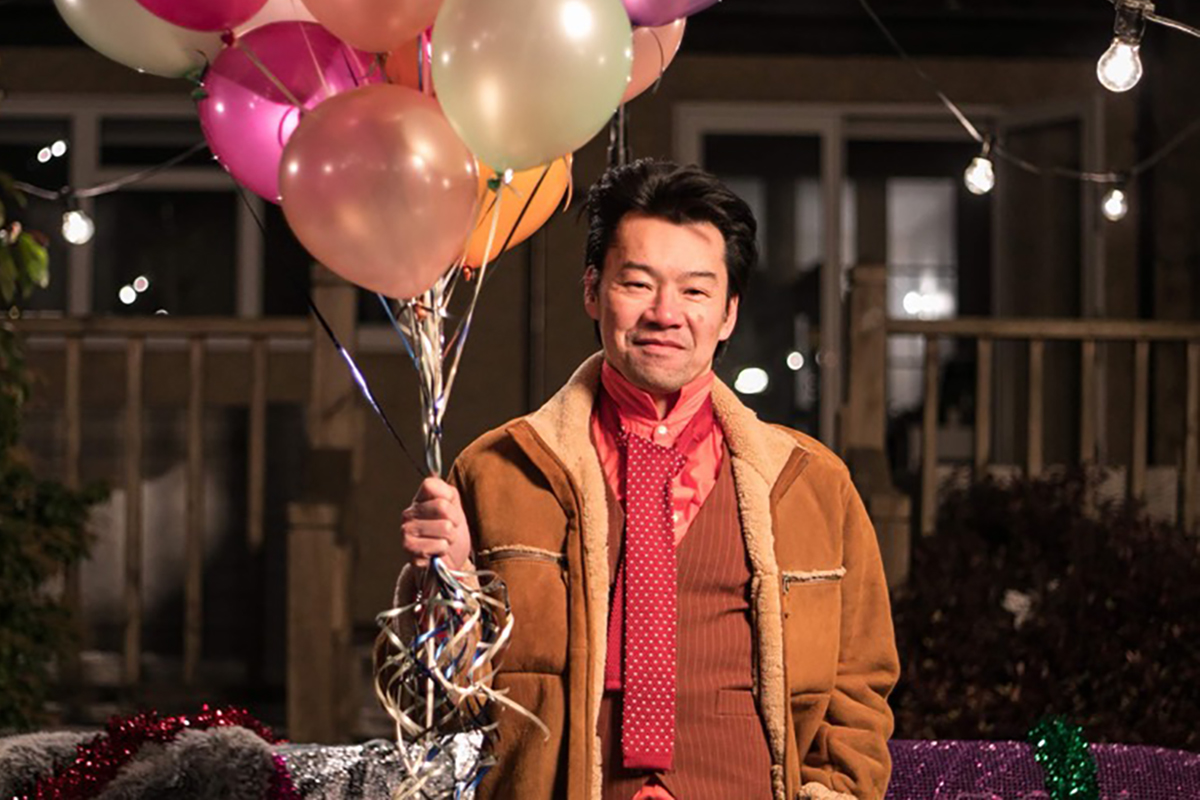 portrait of man with balloons