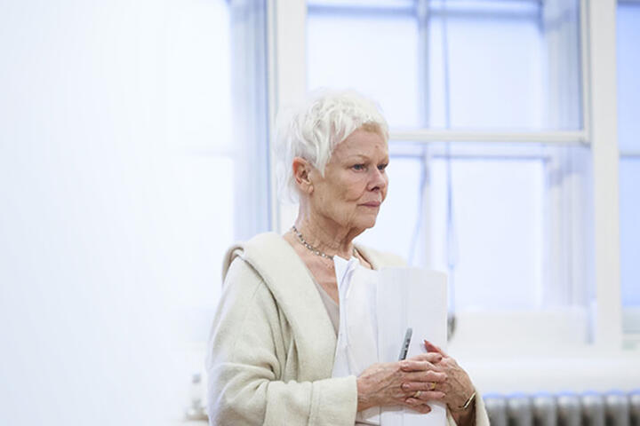 actress holding script during theatre rehearsals
